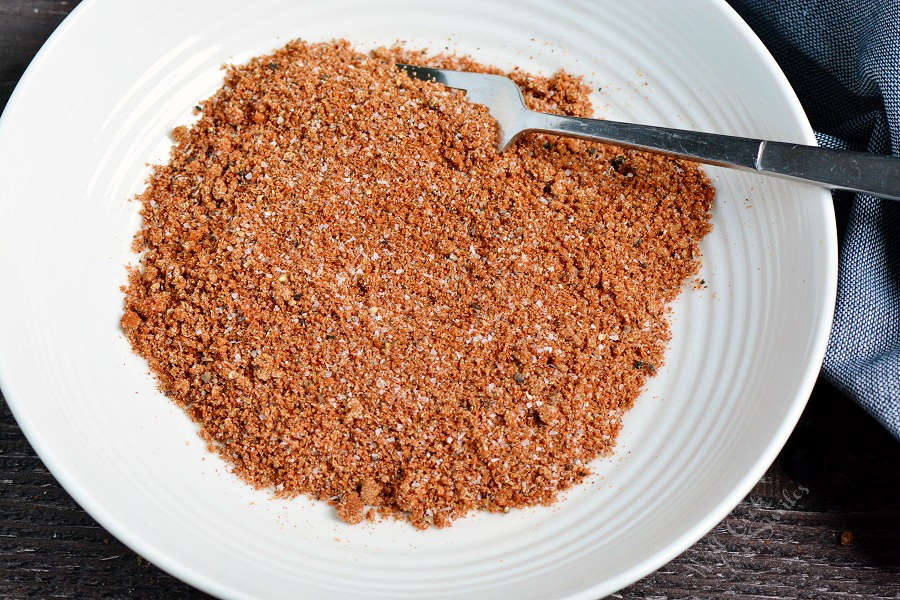 dry rub mixed up in a bowl with a fork 